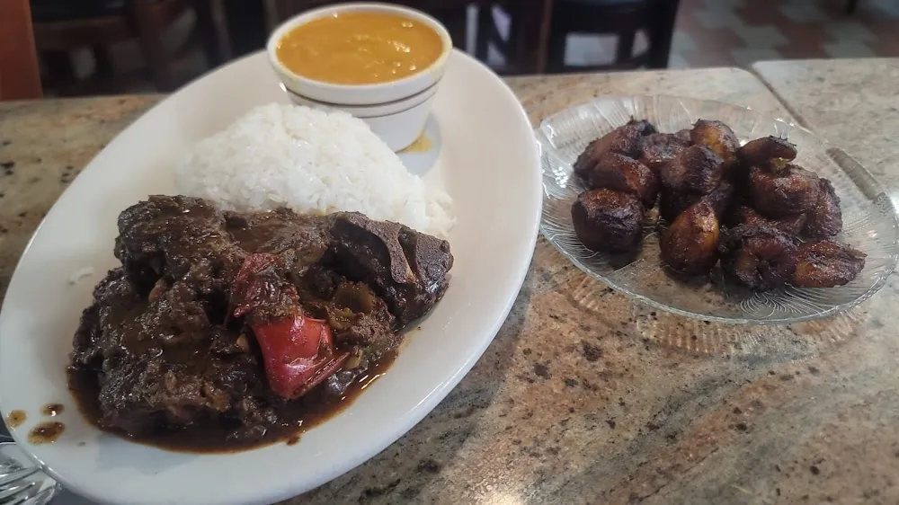 Chivo Guisado Con Arroz Y Frijoles Beans